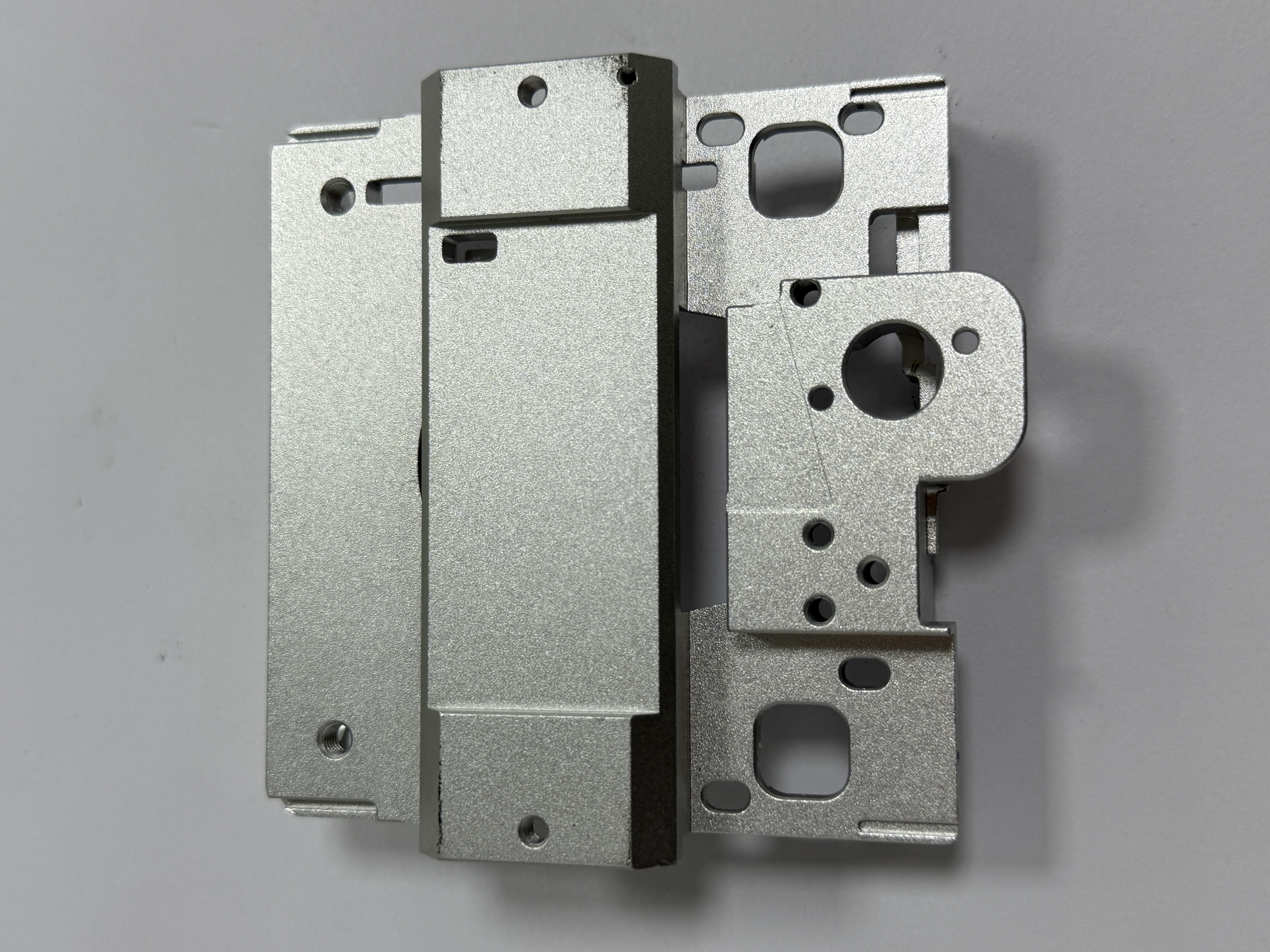 Metal precision components with multiple holes and machined surfaces